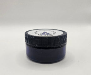 A small rounded blue jar with Blue Frog Hoof Clay